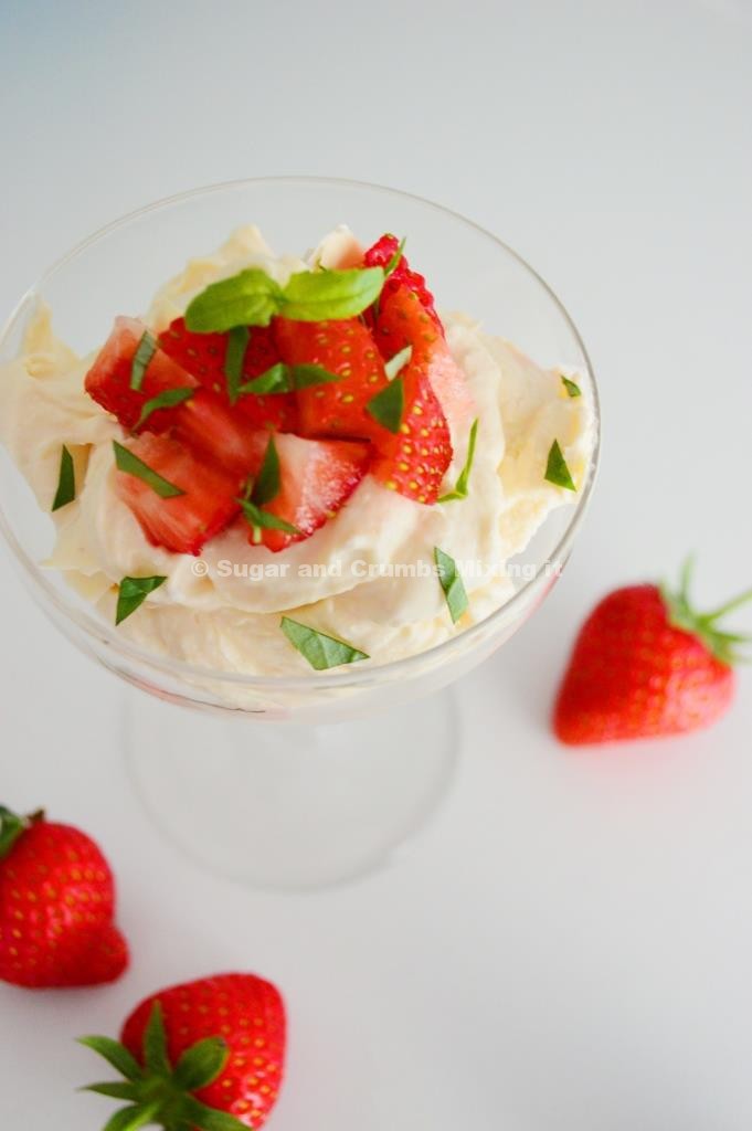 Coconut syllabub with fresh strawberries and basil served in glasses