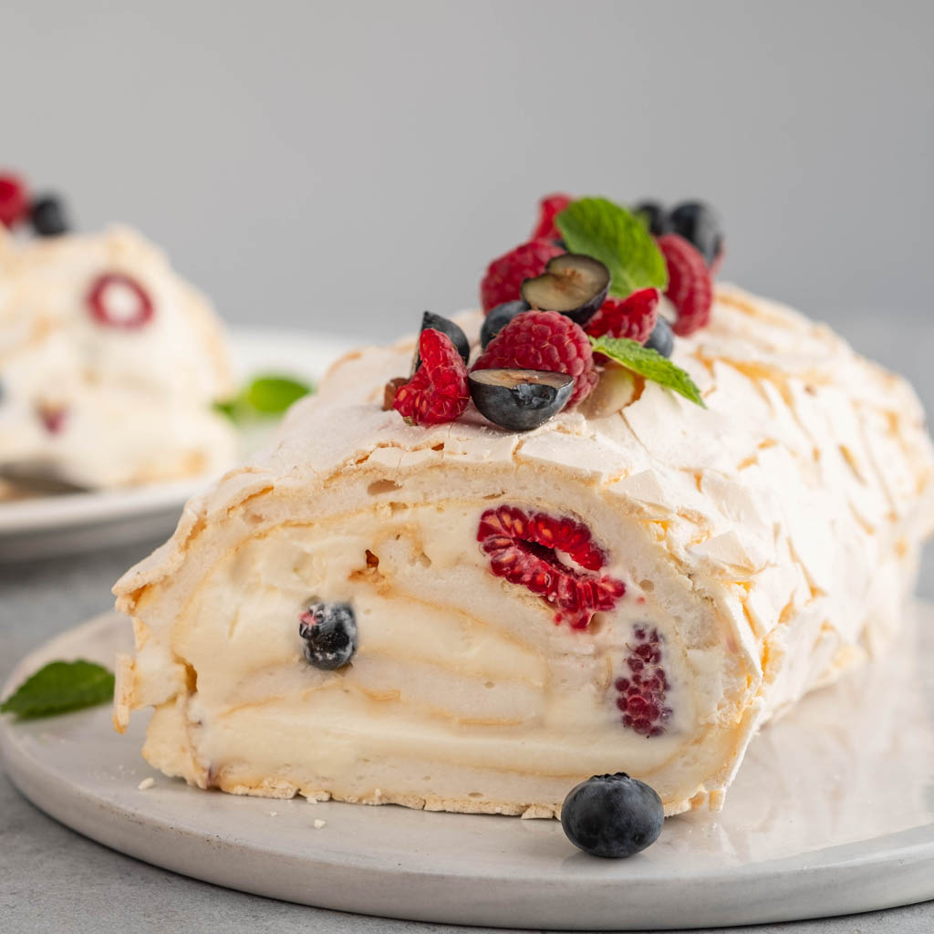 Meringue Roulade with Fresh Cream Sugar and Crumbs Mixing It Up