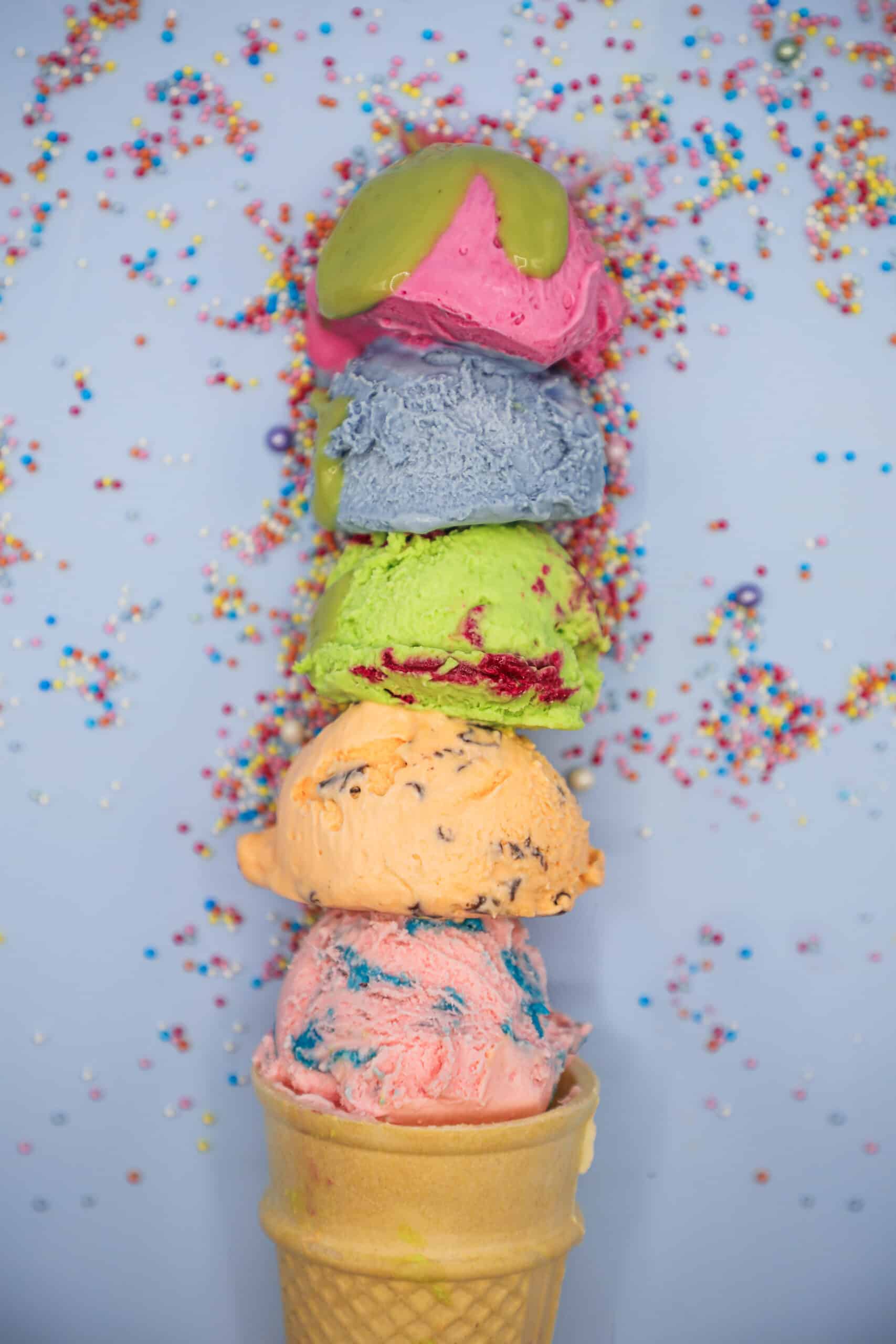 Pile of colorful flower sprinkles for cupcakes and ice-cream. Top